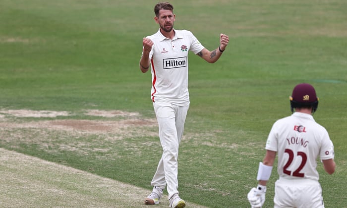 Tom Bailey clenches his fist after taking a wicket.