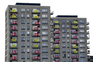 high rise flats with flags at windows