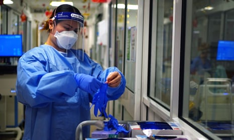 A nurse wears PPE.