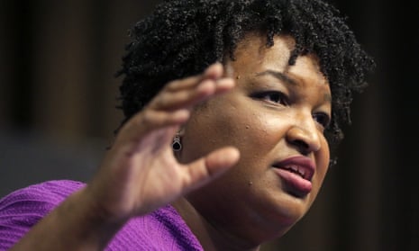 Stacey Abrams said on CNN’s State of the Union on Sunday: ‘I do absolutely agree that it’s racist. It is a redux of Jim Crow in a suit and tie.’