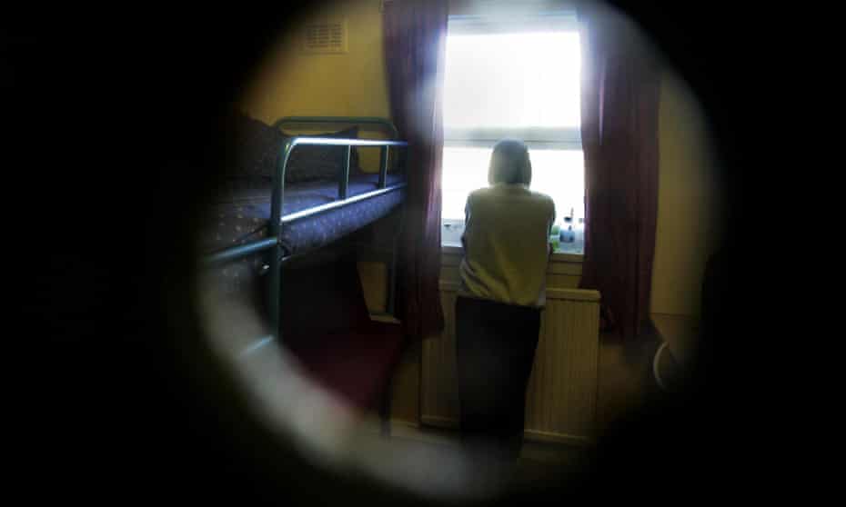Female prisoner seen through keyhole