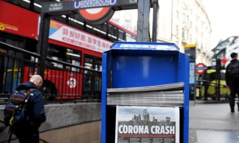 Newspapers on a stand in the City of London on 13 March
