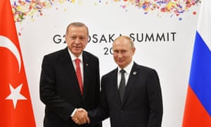 President Erdoğan shakes hands with Vladimir Putin in Osaka, June 2019.