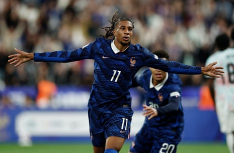 France's Michael Olise celebrates scoring their third goal.