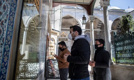Worshippers wearing face masks pray at Istanbul’s Eyüp Sultan mosque.