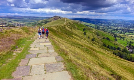 Hikers on the flagged footpath along the Great Ridge above Castleton.