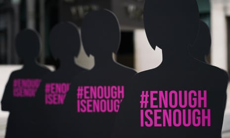 Silhouettes of women are placed outside New Scotland Yard by the charity Refuge in a campaign against domestic violence.