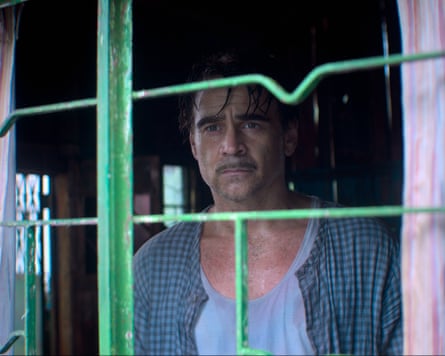 Colin Farrell looking intensely through a window