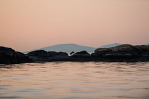 Takaya traverses rocks at sunset