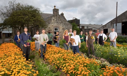 Buchanan-Smith brothers Charlie (with dog) and Angus (sunflower), chef Craig Turner (apron) and the Free Company team.