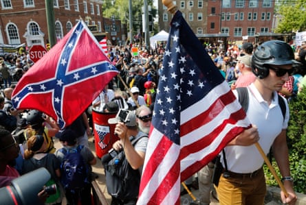 crowd of peolple hold flags