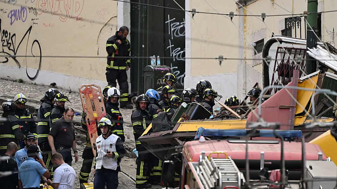 First responders work at the site of a crashed funicular car