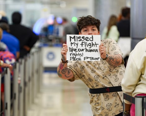 A person holds up a sign from the security line at Atlanta airport.