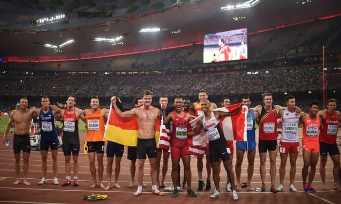 Gold medallist Ashton Eaton, front centre, celebrates with bronze medallist Rico Freimuth, front left, and silver medallilst Damian Warner, front right, and the rest of the athletes after finishing the decathlon