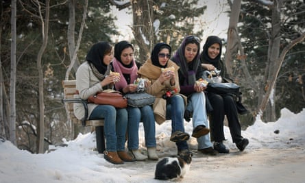 Women eat in the park in Tehran.