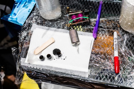 A tattoo station with ink pots ready to go