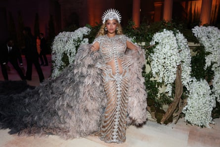 Beyoncé dressed from collarbone to ankle in sparkling crystal bones over a sheer flesh-toned dress