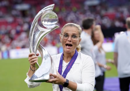 Sarina Wiegman makes a funny face while holding the Women’s Euro 2022 trophy