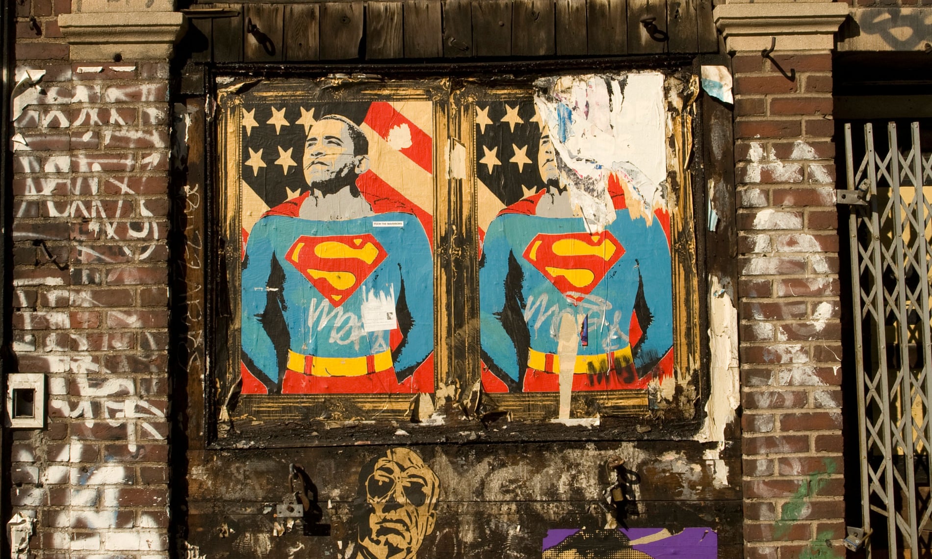 faded and torn posters of Barack Obama as superman on a wall in New York City