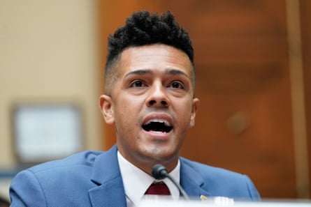 a man speaking in front of a microphone