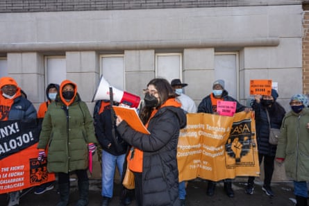 person with megaphone at housing protest