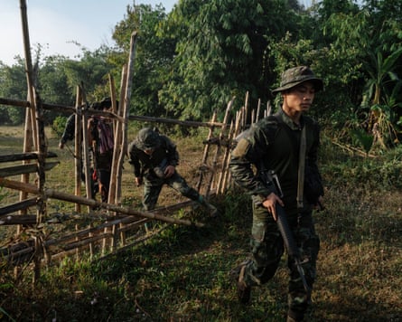 Soldiers from the People’s Defence Forces in open fields