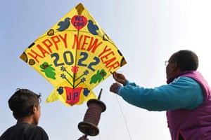 Amritsar. A kitemaker flies a kite ahead of the New Year celebrations.