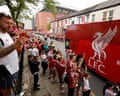 Liverpool fans welcome the team bus as it arrives outside the stadium before the pre-season friendly with Monaco