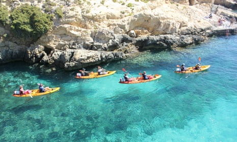 FOur kayaks in blue sea, Gozo