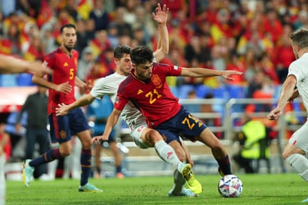 Spain’s Pedri tussles with Remo Freuler of Switzerland during a Nations League match