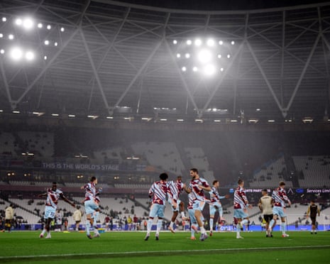Players warm up at London Stadium.