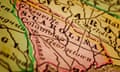 Pink outline of South Carolina on antique map.
