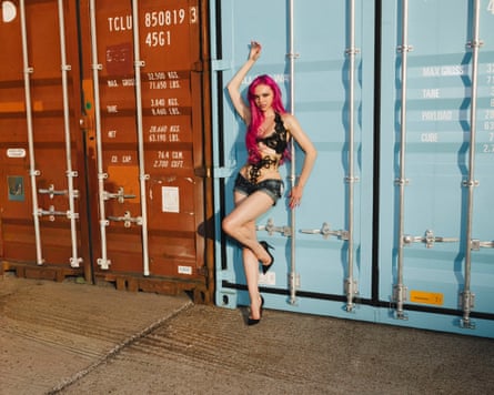 Adéla, shot against a backdrop of shipping containers