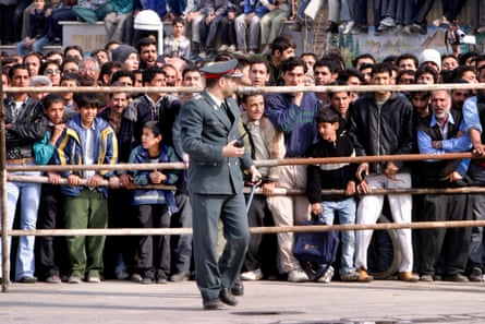 people gather to watch an execution