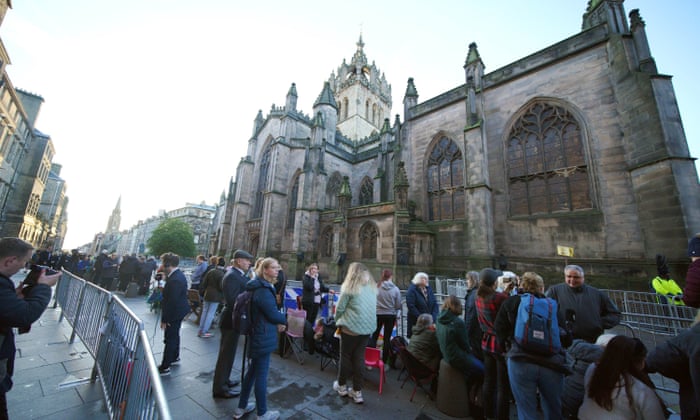 People gather outside St Giles' Cathedral in Edinburgh.