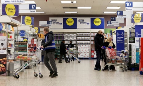 People shopping in a branch of Tesco