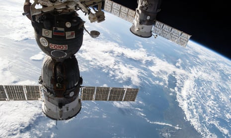 A different Russian Progress cargo craft (R) is seen docked to a spacecraft to supply the International Space Station.