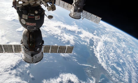 the Soyuz TMA-15M spacecraft on the left attached to the International Space Station in 2014, while Samantha Cristoforetti was on board.