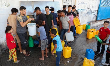Palestinians fetch water in the southern Gaza Strip city of Khan Younis.