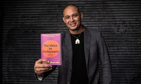 Thomas Mayo holds The Voice to Parliament Handbook