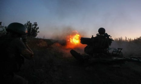 A Ukrainian serviceman fires a ZU-23-2 anti-aircraft cannon near a frontline in the Kharkiv region.