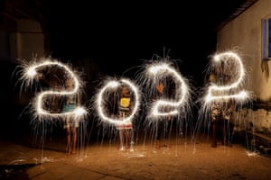 Colombo, Sri LankaSri Lankan children write ‘2022’ with firecrackers during New Year’s celebrations in Colombo.