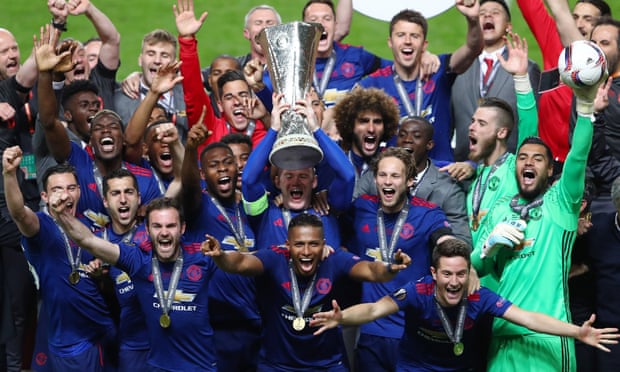The Manchester United players with the Europa League trophy after beating Ajax in the final on 24 May. 