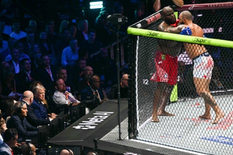 Trump watches two men fighting
