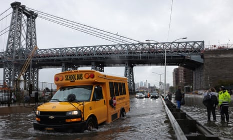 A school bus drives in floodwaters at the FDR Drive in Manhattan on 29 September. 