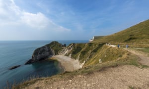 Coastal footpath looking down at the sea on Jurassic Coast, west of Lulworth Cove Dorset, England