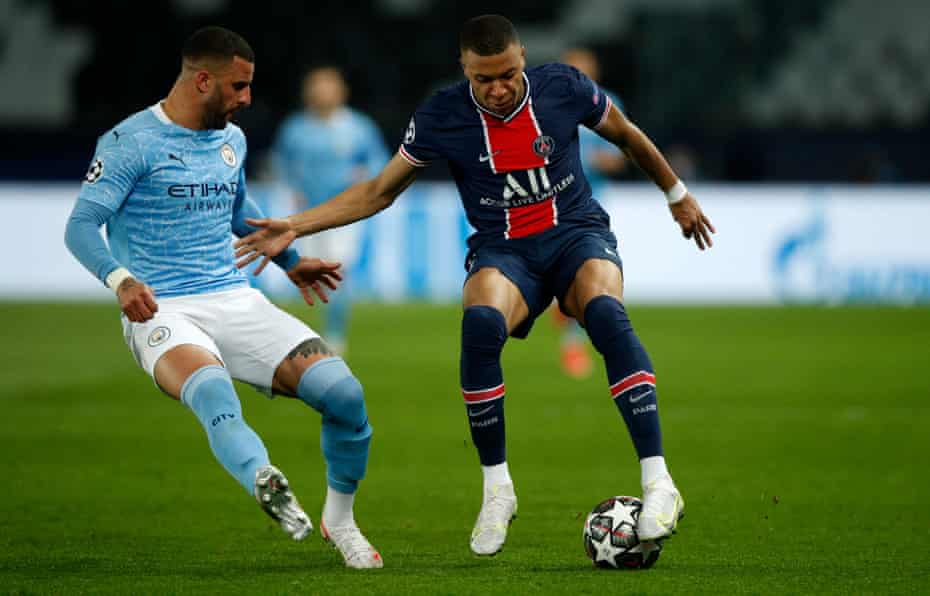 Kyle Walker (left) keeps a close eye on Kylian Mbappé.