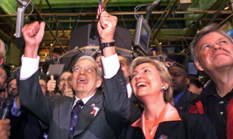 Then Treasury Secretary Paul O’Neill, left, is joined by then Senator Hillary Rodham Clinton and then New York City Fire Commissioner Thomas Von Essen, right, on the New York Stock Exchange trading floor when trading resumed for the first time since the previous week’s terrorist attack.