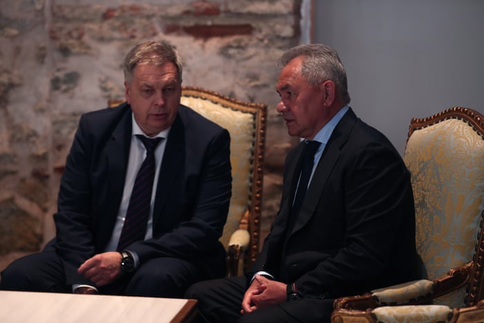 Russia-Ukraine war: Kyiv and Moscow sign deal to allow grain exports from blockaded Black Sea ports – live 4 Russian Defence Minister Sergei Shoigu (R) waits prior to a signing ceremony of the grain shipment agreement.