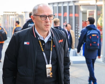 Stefano Domenicali, the CEO of F1, walks in the Suzuka paddock